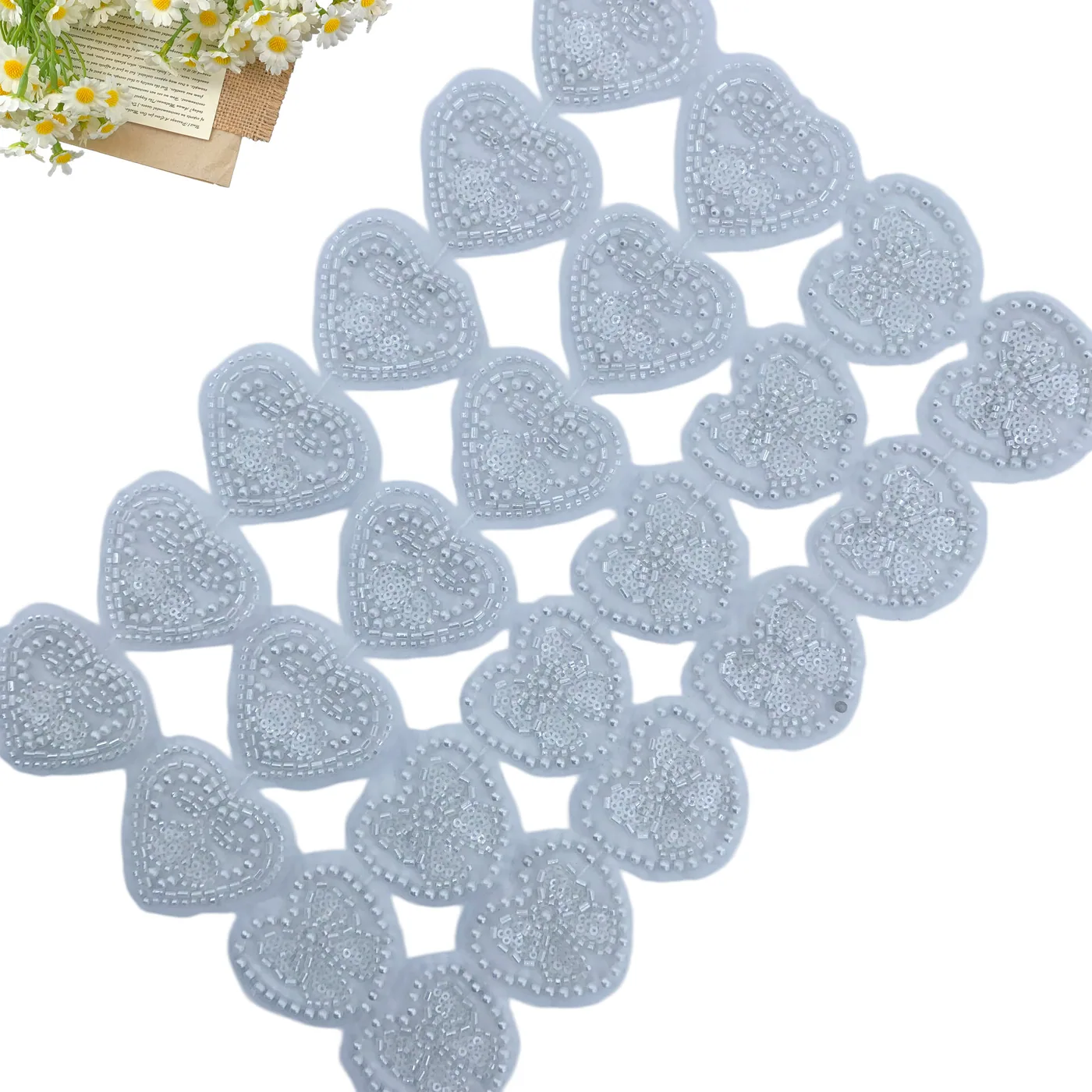White beaded heart motif trim · MET-1002 — product view