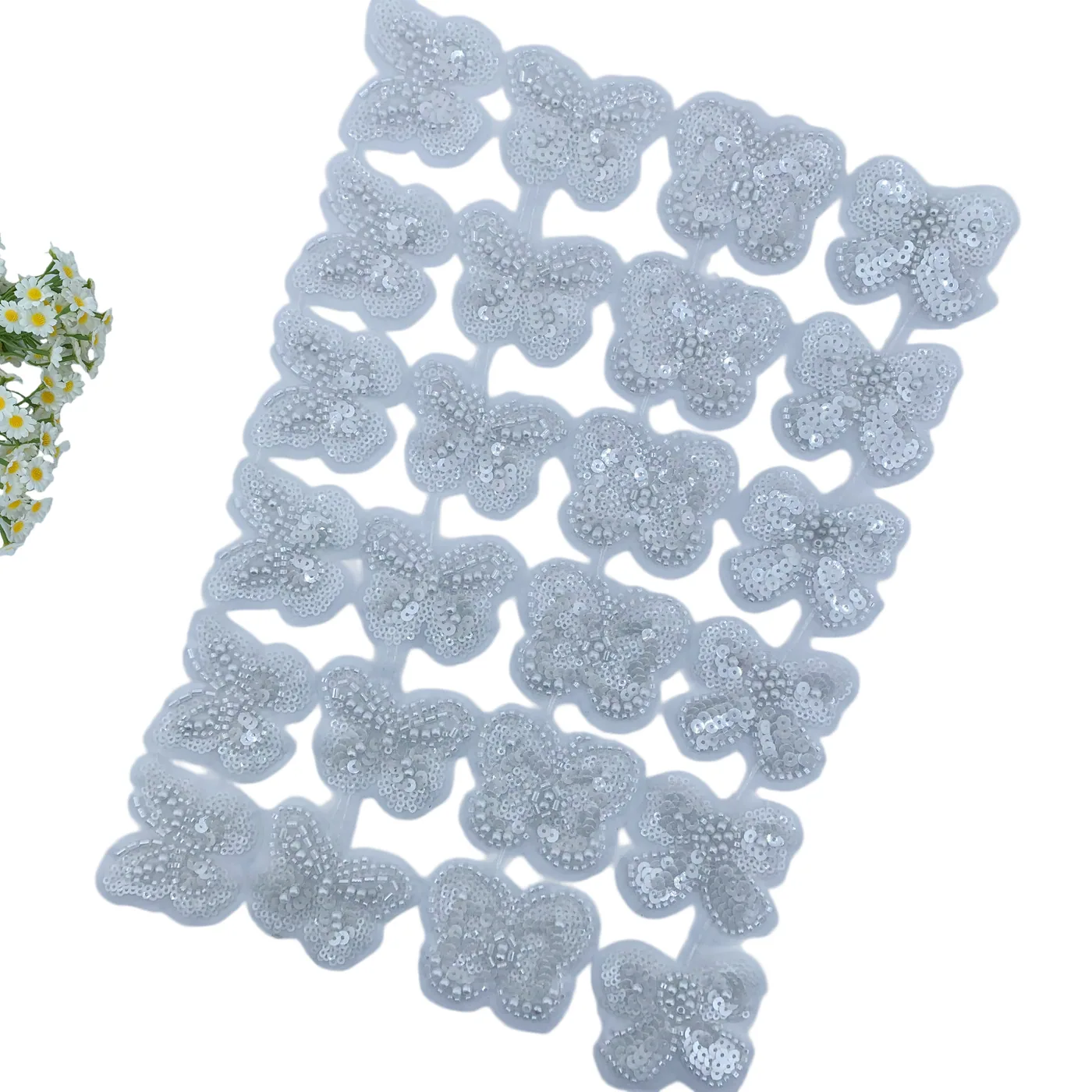 White beaded butterfly trim · MET-1004 — product view
