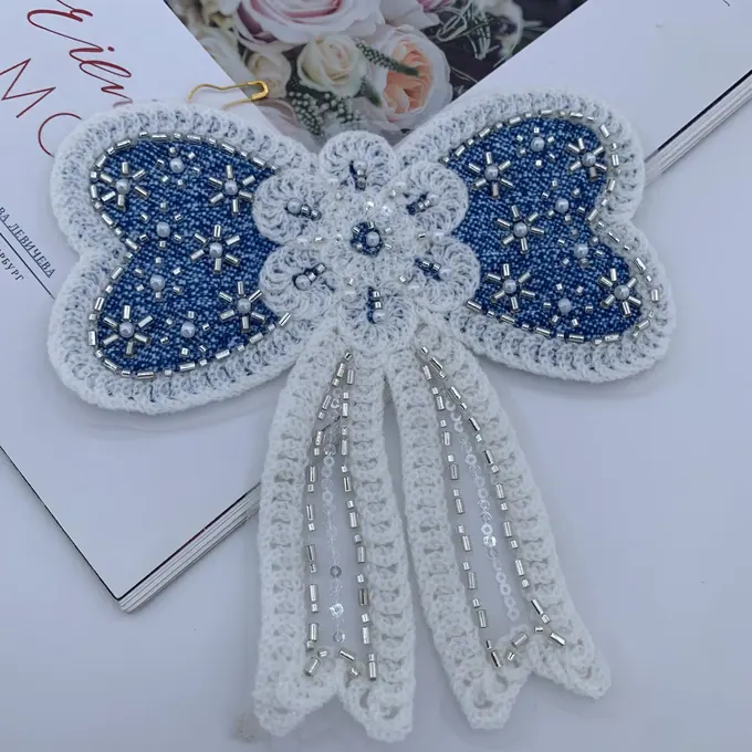 Beaded ribbon-tail bow appliqué · MET-4055 — product view