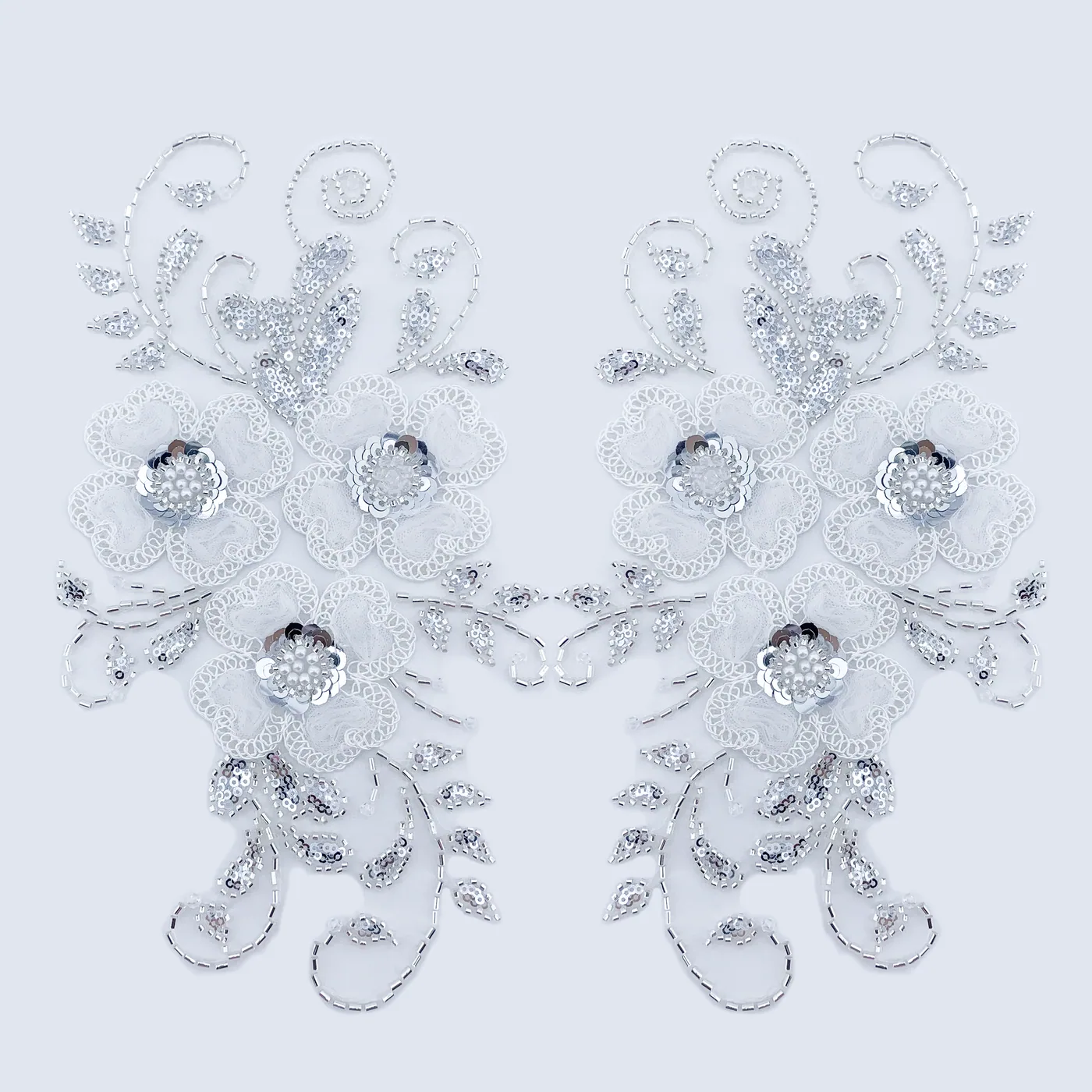 Paired silver floral scroll appliqués · MET-5003 — product view