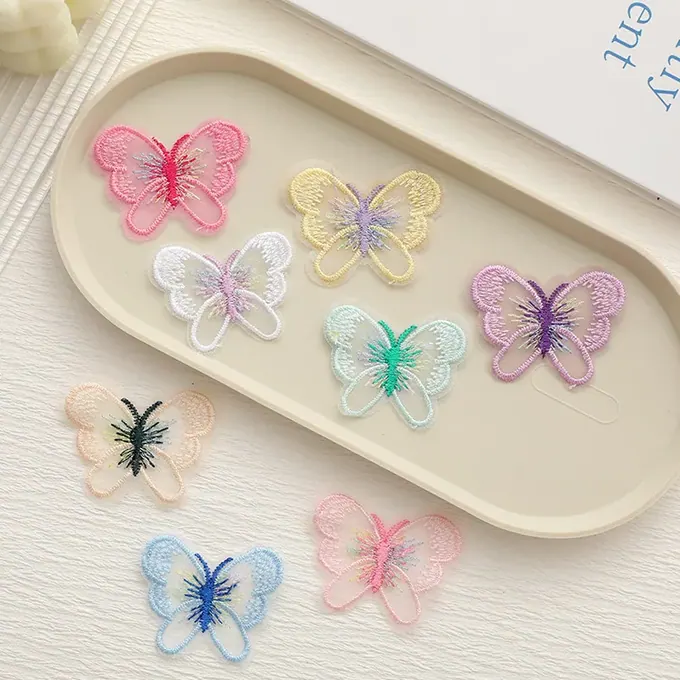 Pastel single-layer embroidered butterfly appliqué · MET-8014 — product view