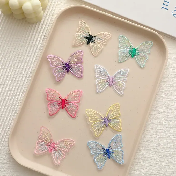Pastel single-layer embroidered butterfly appliqué · MET-8015 — product view