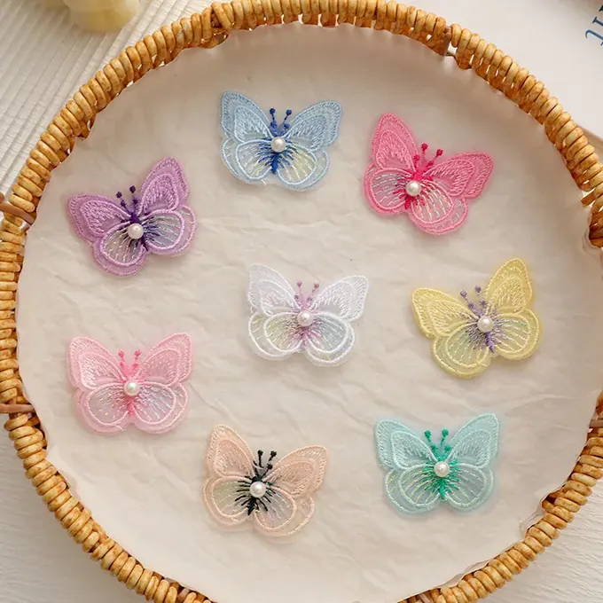 Layered embroidered butterfly appliqué · MET-8048 — product view