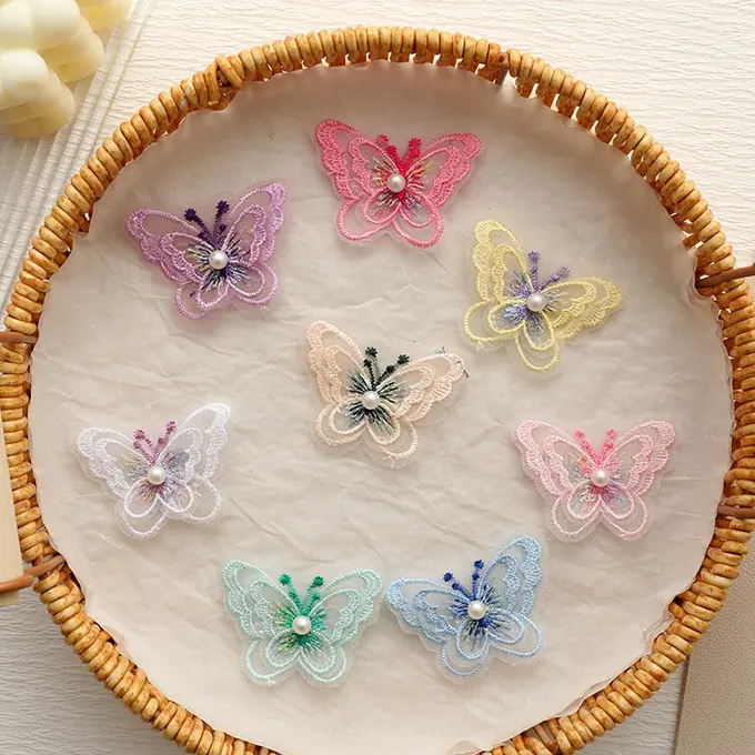 Layered embroidered butterfly appliqué · MET-8050 — product view
