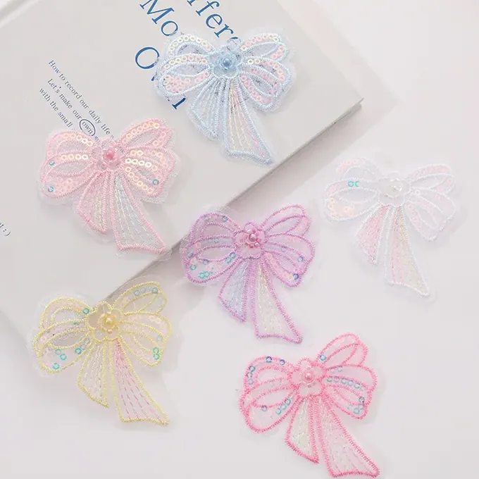 Single-layer embroidered bow appliqué · MET-8071 — product view