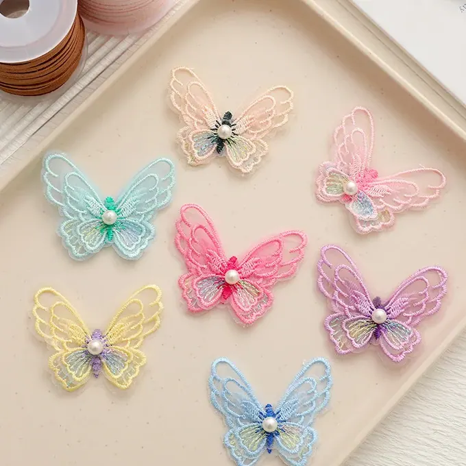 Layered embroidered butterfly appliqué · MET-8093 — product view